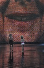 Two girls standing in front of the Crown Fountain