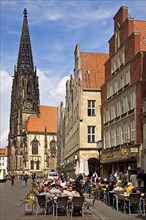 Outdoor cafe in Prinzipalmarkt street with Lambertikirche Church