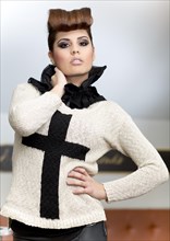 Young woman with an updo hair style wearing a collared sweater