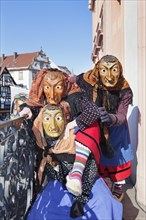 Three witches on the balcony of Gengenbach Town Hall