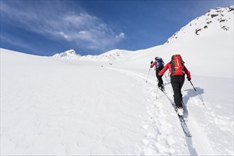 Ski tourers climbing Stotz mountain