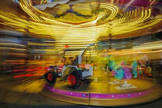 Children's carousel in motion