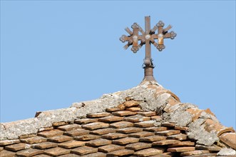 The cross on the tiled roof