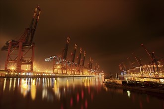 Waltershoferdamm 2 with the cranes of Container Terminal Burchardkai and EUROGATE Container Terminal