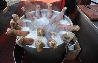 Pigs' feet boiling in a large pot at the annual All Saints Market in Cocentaina