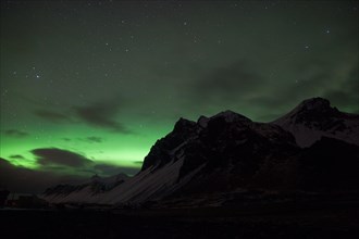 Northern lights over a mountain range