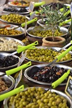 Various types of olives at a market stall