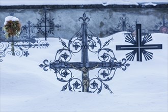 Grave crosses in deep snow