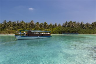 Boat in front of a Maldives island