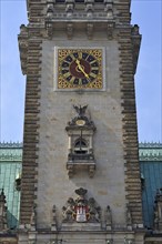 City coat of arms and clock on the tower