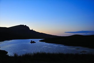 View at dusk across Loch Fada to The Storr with the Old Man of Storr pinnacle