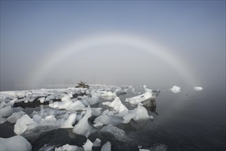 A fog rainbow and beached icebergs at Pakenham Point
