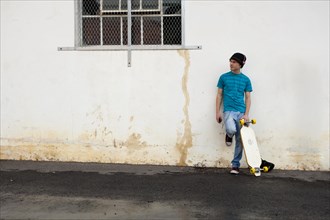 Teenager with his longboard