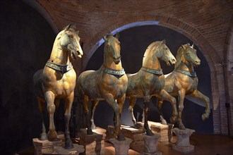 Four bronze horses