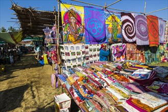 Colourful fabrics for sale at the weekly flea market