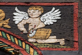 Angel with drums on a half-timbered house