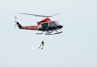Air-sea rescue service exercise with a frogman on a winch
