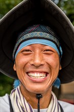 Portrait of a smiling Japanese rickshaw puller