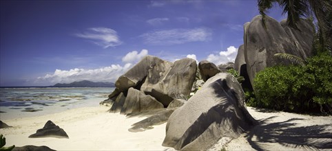 Typical rock formations in the Seychelles with a sandy beach