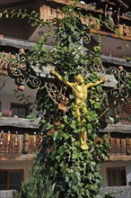 Crucifix entwined with ivy
