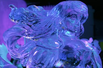 Female figure with flowing hair made of ice