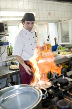Flambe cooking in a kitchen