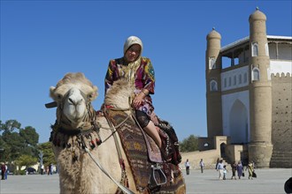 Local tourist on a camel in front of the Ark fortress