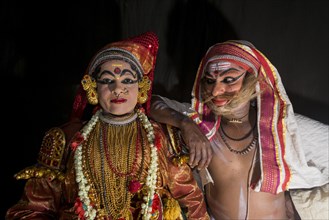 Two Katakali artists with the complete make up of the characters Sathi
