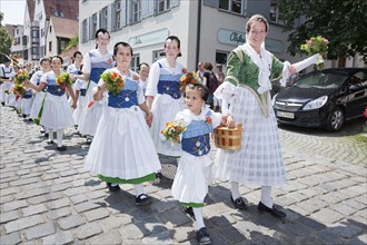 Women and children during a parade through the historic town centre