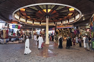 Customers and shops in the Muttrah Souq market