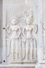 Bas relief of two Apsaras at Angkor Wat