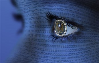 NSA logo in a woman's eye and binary code