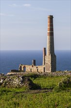 Ruins and chimney of the crushing plant of the former tin and copper mine Levant Mine