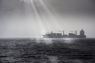Container ship in bad weather on the high seas off Africa