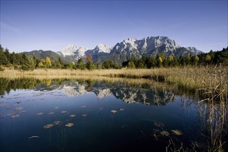 The Northern Karwendel chain in autumn reflected in Luttensee