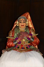 Fully made-up and costumed Kathakali dancer during a performance