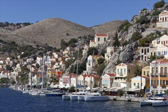 Harbour of the town of Symi with picturesque houses in the neo-classical style