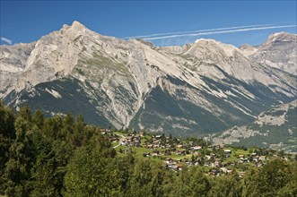 View from Haute-Nendaz over the Rhone Valley towards the summit of Haut de Cry Mountain in the Bernese Alps