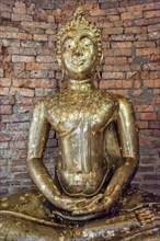 Buddha statue covered with gold leaves