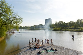 Young people having party on the Isar River in summer