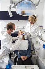 Woman receiving treatment at the dentist