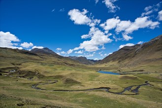 Mountain valley with river and small lake