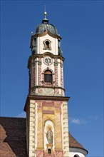 Bell tower of the parish church of St. Peter and Paul with Luftlmalerei