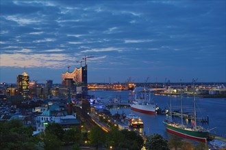 The museum ships Rickmers Rickmers and Cap San Diego on the Elbe River at dusk