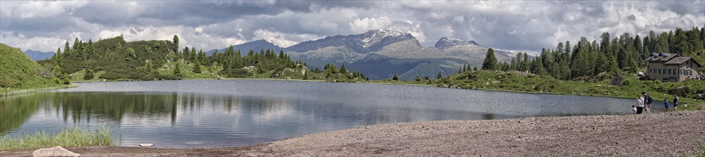 Panoramic view of the largest Colbricon lake from the riverside