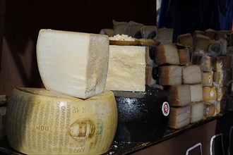 Parmesan and other hard cheeses on display at the annual All Saints Market in Cocentaina