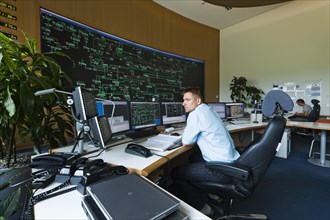 Engineer sitting at his work station in the Transmission Control Center