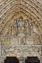 Stone reliefs above the entrance of Cathedrale Notre Dame