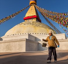 A man walking around Boudhanath stupa