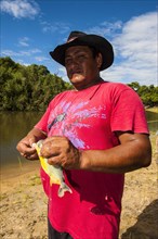 Man holding a piranha